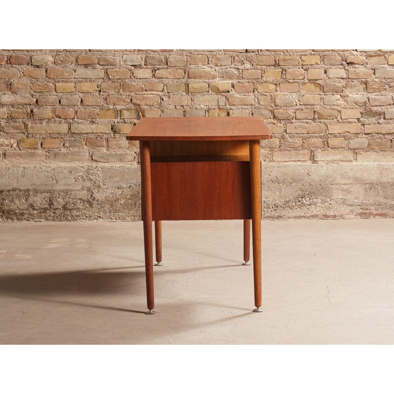 Vintage teak desk with elegant light lines renovated with touches of black 1960s