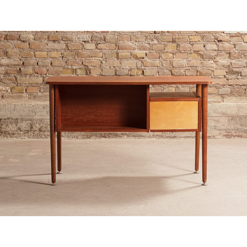 Vintage teak desk with elegant light lines renovated with touches of black 1960s