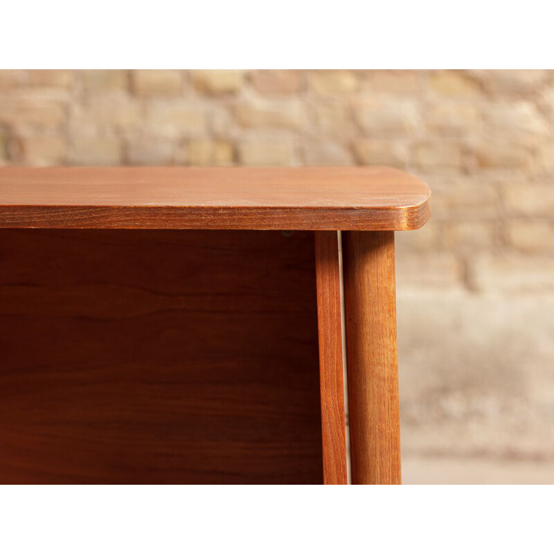 Vintage teak desk with elegant light lines renovated with touches of black 1960s