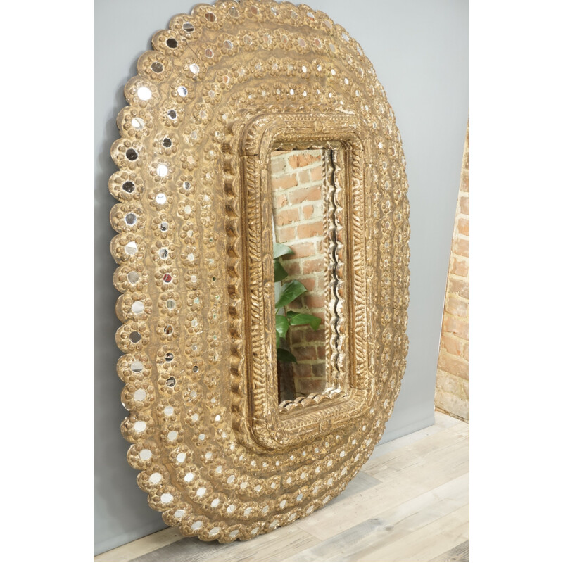 Vintage oval mirror in carved wood