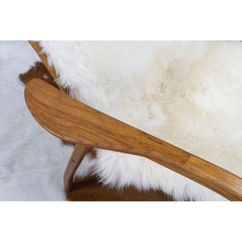 Vintage Yngve Ekstrom Lamino High back lounge chair in oak and sheepskin, Swedese 1951s