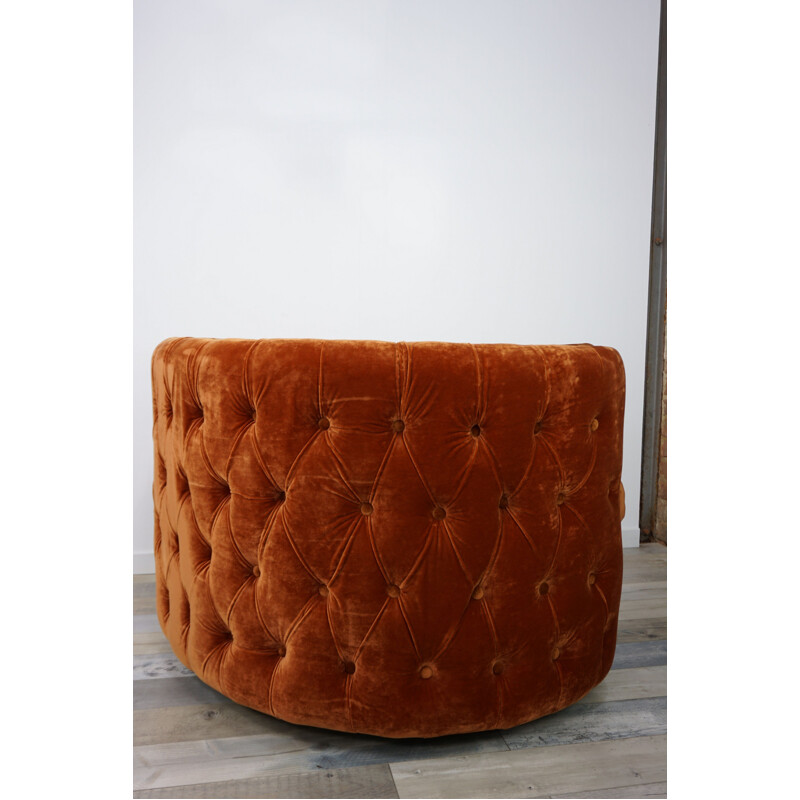 Fauteuil vintage pivotant capitonné en velours