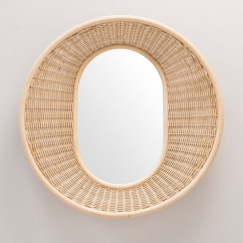 Round vintage mirror in woven rattan