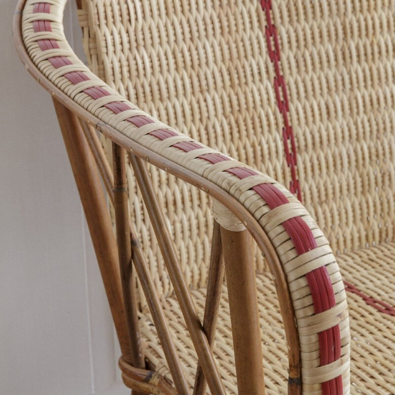 Vintage woven rattan sofa with red edging