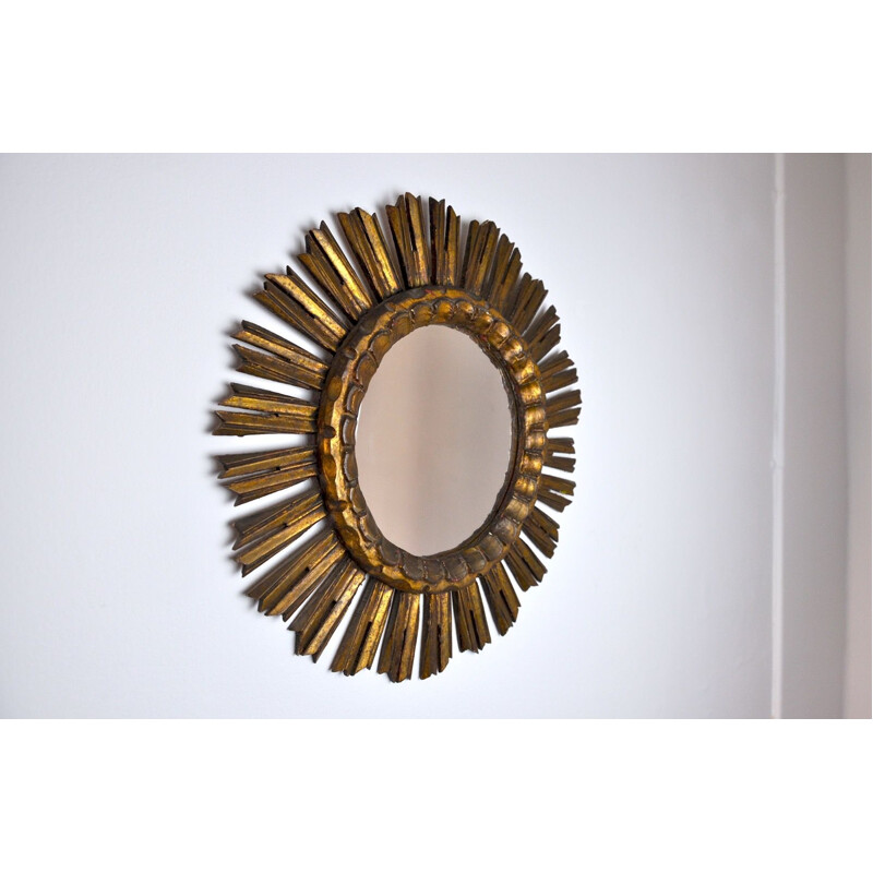 Vintage sunburst mirror in golden wood 1950