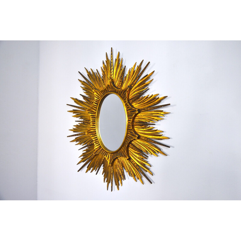 Specchio d'epoca con raggi di sole in legno dorato
