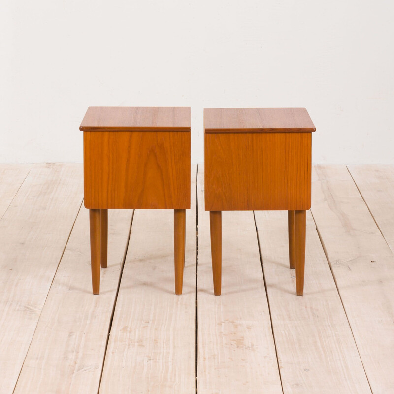 Pair of vintage teak nightstands with 2 drawers with sculptular handles, Norway 1960s