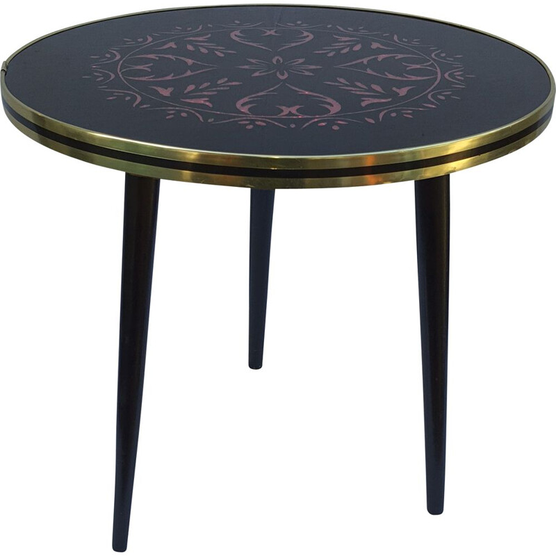 Vintage coffee table with black glass top