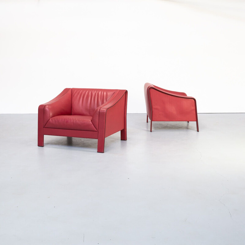 Pair of red vintage leather armchairs, Italy 1980s