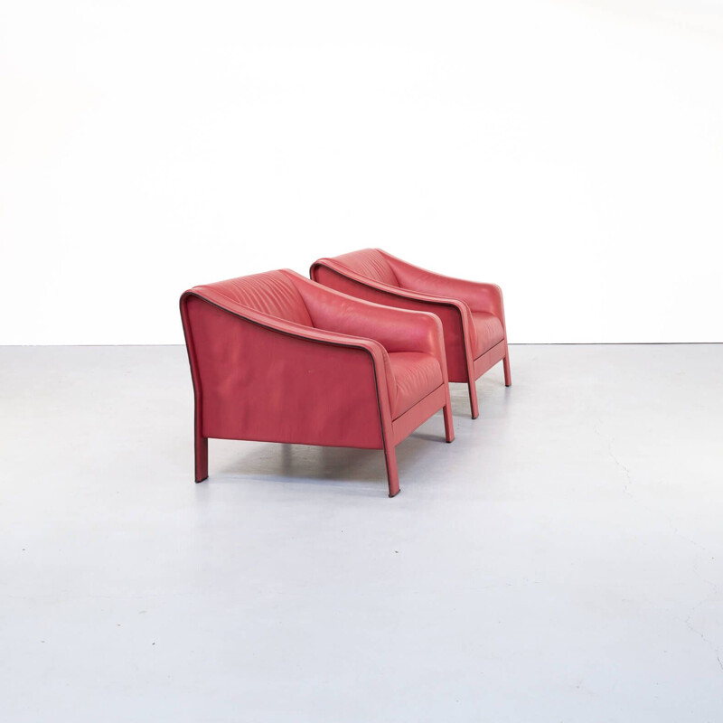 Pair of red vintage leather armchairs, Italy 1980s