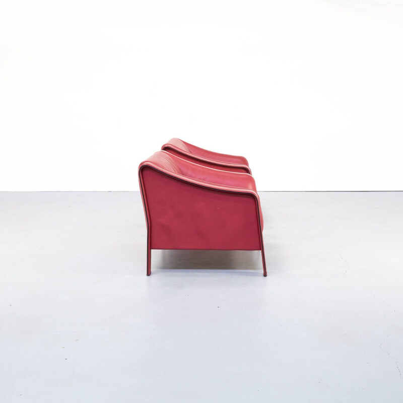 Pair of red vintage leather armchairs, Italy 1980s