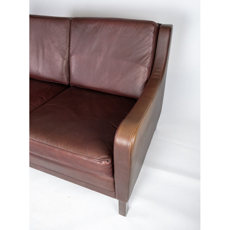 Vintage Two seater sofa with red brown leather by Stouby Furniture