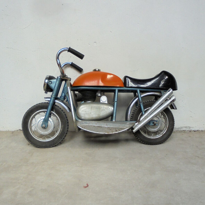 Vintage motorcycle in sheet metal 1950s