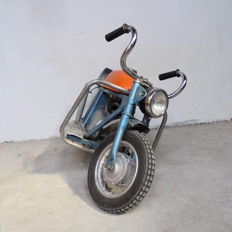 Vintage motorcycle in sheet metal 1950s