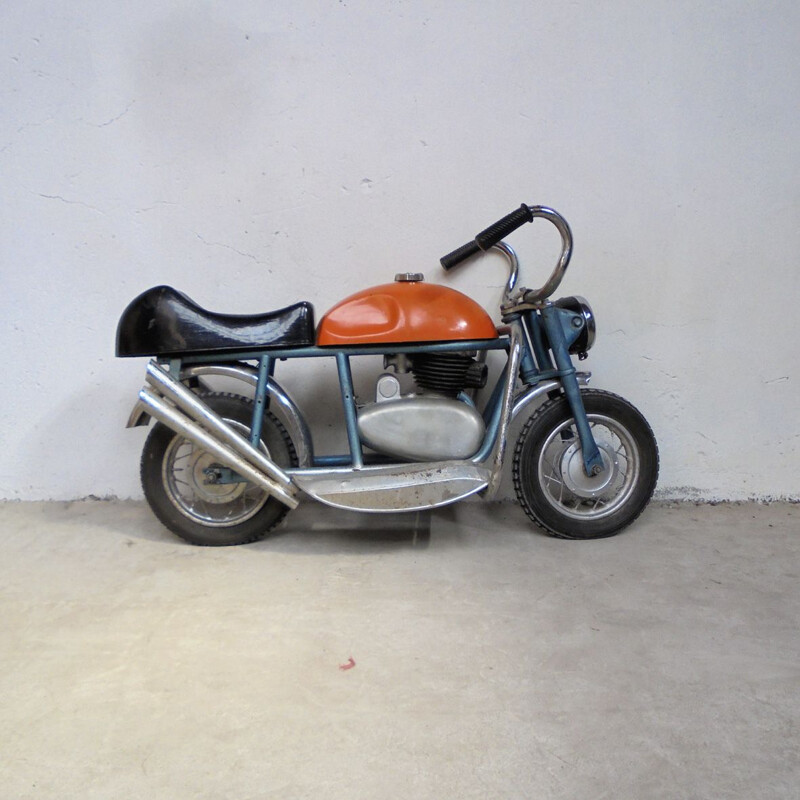 Vintage motorcycle in sheet metal 1950s