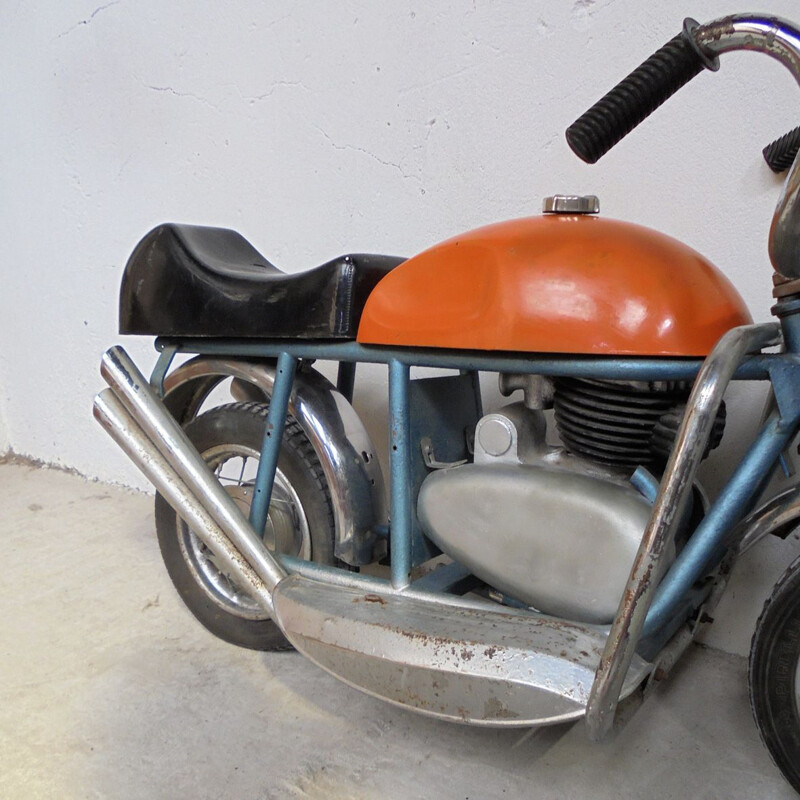 Vintage motorcycle in sheet metal 1950s
