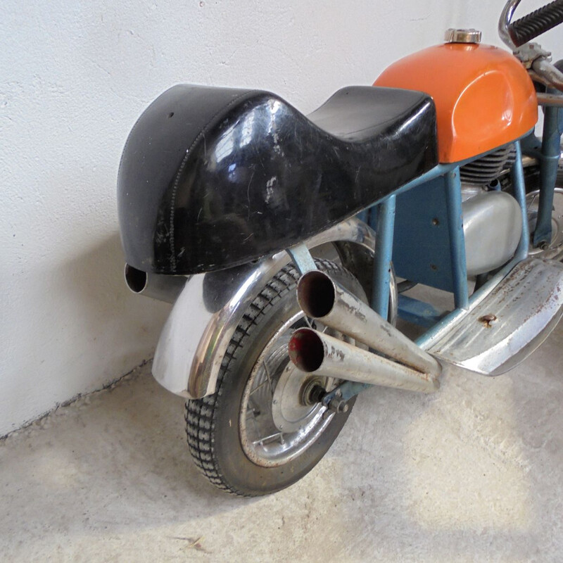 Vintage motorcycle in sheet metal 1950s