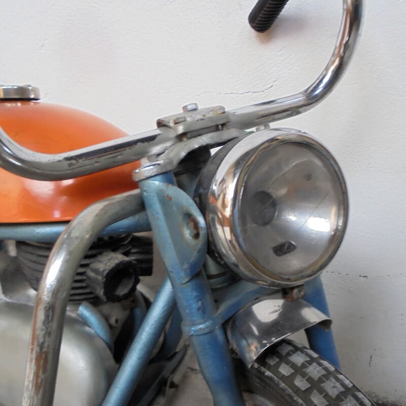 Vintage motorcycle in sheet metal 1950s