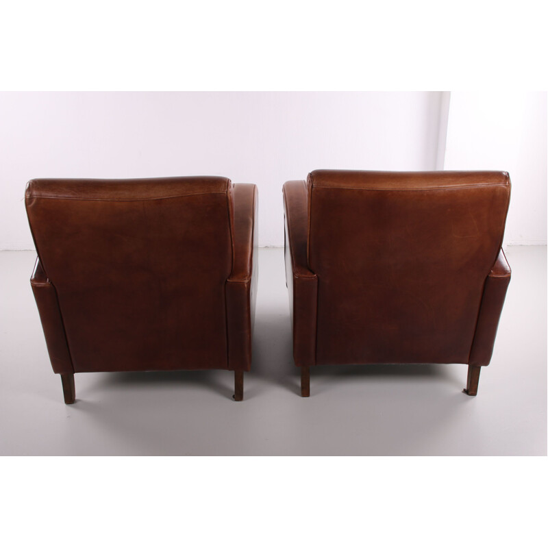 Pair de fauteuils Club Vintage en cuir de mouton 1970 modèle roue de chariot 1970