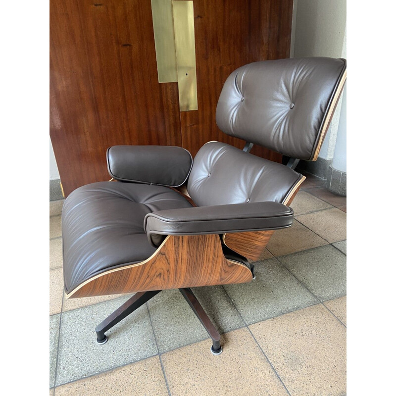 Vintage Charles Eames brown leather lounge chair and ottoman 2011s