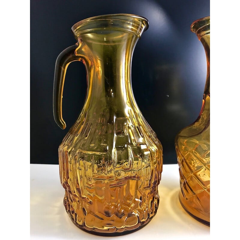 Pair of vintage glass decanters with honey, Italy