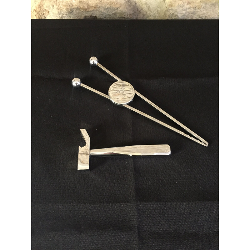 Vintage sugar tongs and bottle opener set by J.Adnet