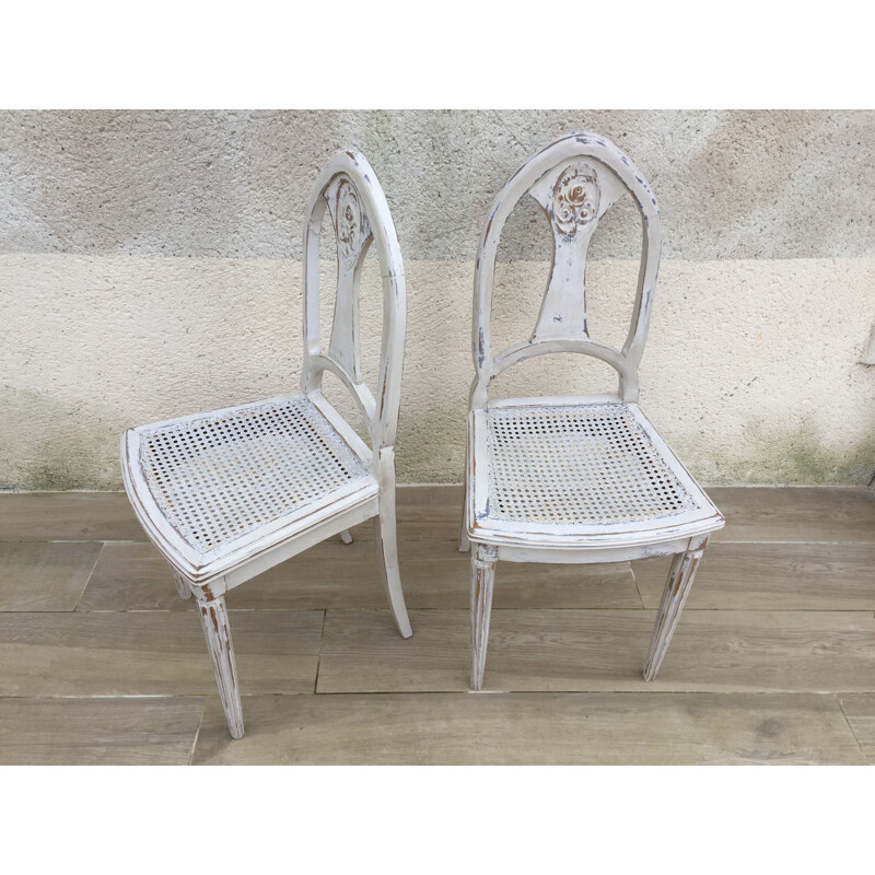 Paire de chaises vintage cannées blanches