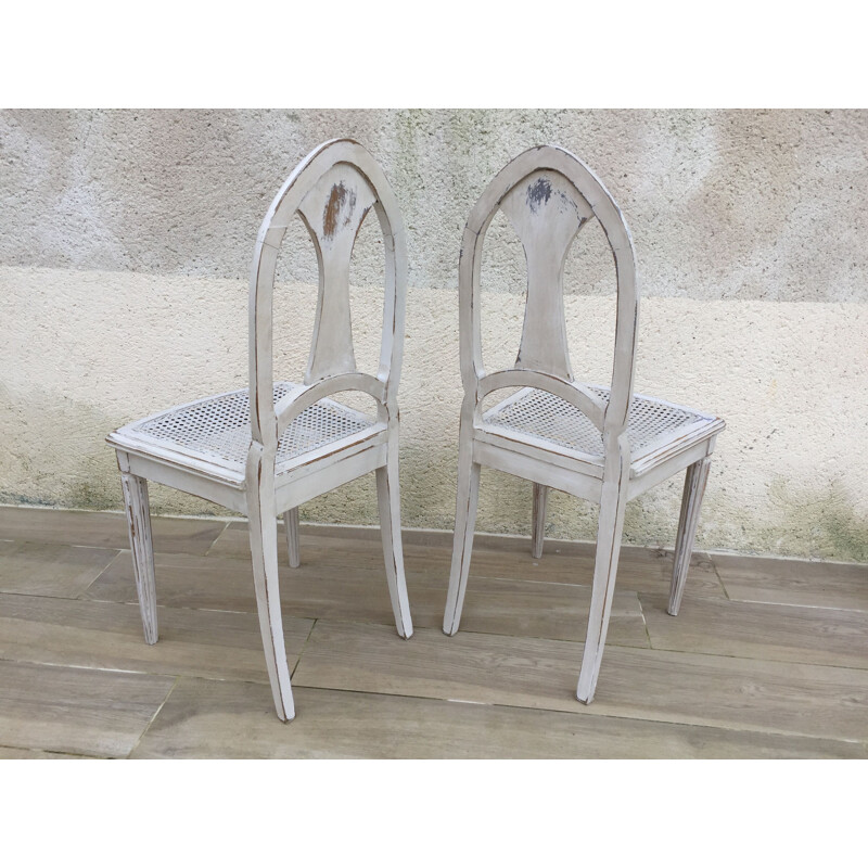 Paire de chaises vintage cannées blanches