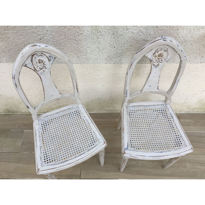 Paire de chaises vintage cannées blanches