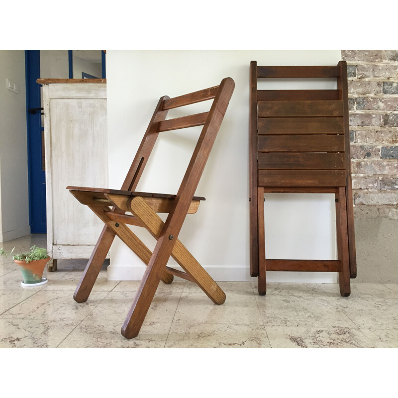 Pair of vintage woodstamped folding chairs