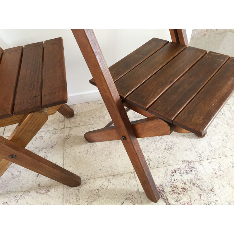 Pair of vintage woodstamped folding chairs