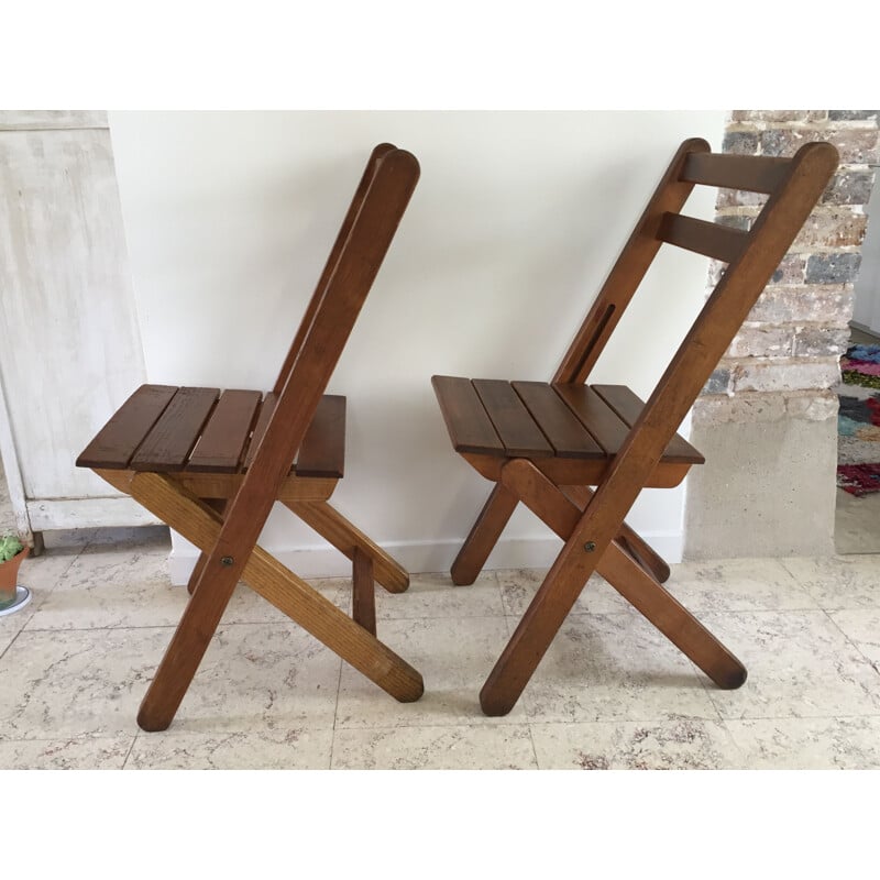 Pair of vintage woodstamped folding chairs