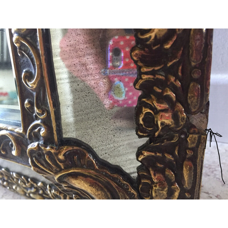 Vintage mirror with brass glazing