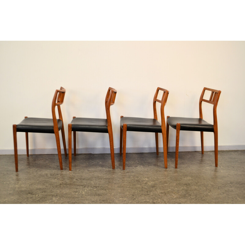 Set of 4 Scandinavian JL Møllers chairs in teak and black leather, Niels Otto MØLLER - 1960s