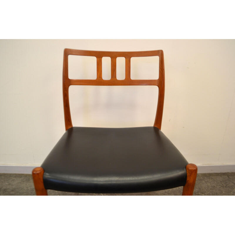 Set of 4 Scandinavian JL Møllers chairs in teak and black leather, Niels Otto MØLLER - 1960s