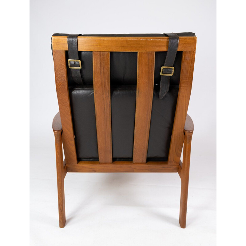 Poltrona vintage con sgabello in teak rivestito in pelle nera di Arne Vodder per Komfort, 1960