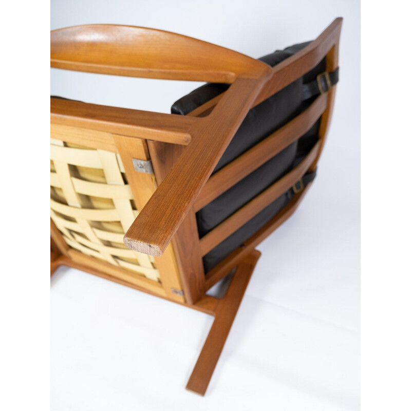 Poltrona vintage con sgabello in teak rivestito in pelle nera di Arne Vodder per Komfort, 1960