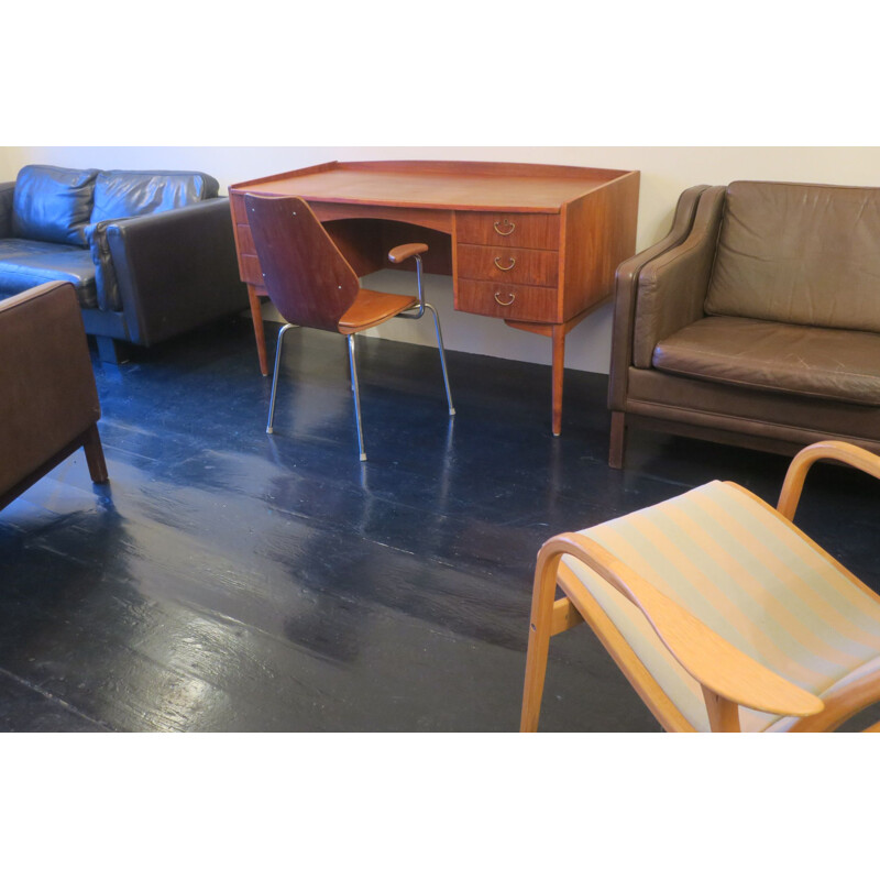 Vintage teak desk with curved shape raised edge and storage space Danish 1960s