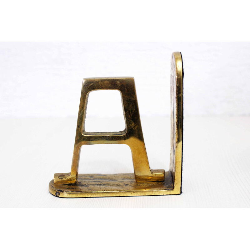 Vintage Alpha Omega bookend in brass