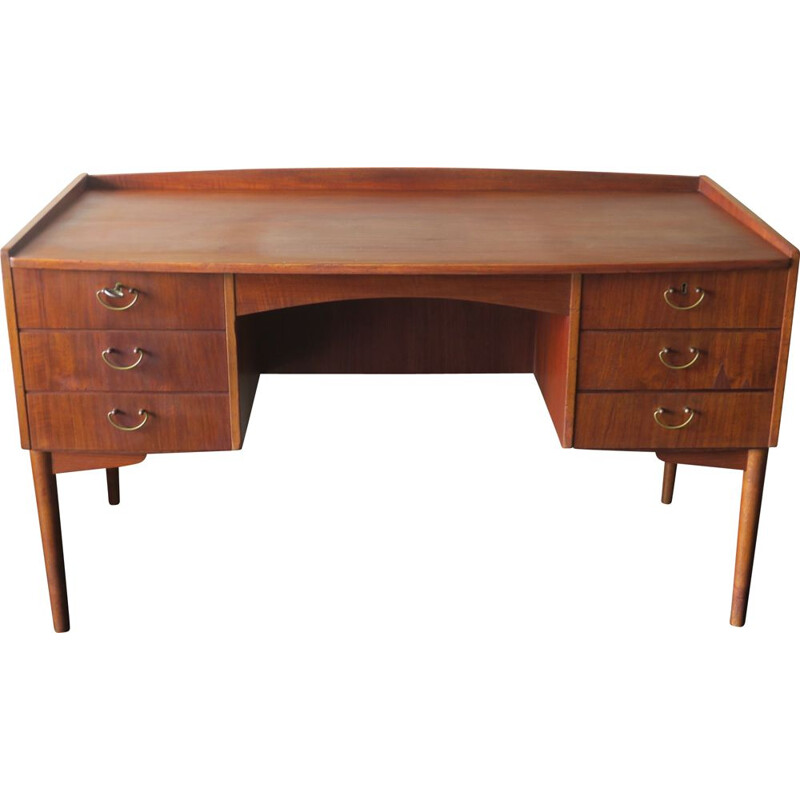 Vintage teak desk with curved shape raised edge and storage space Danish 1960s