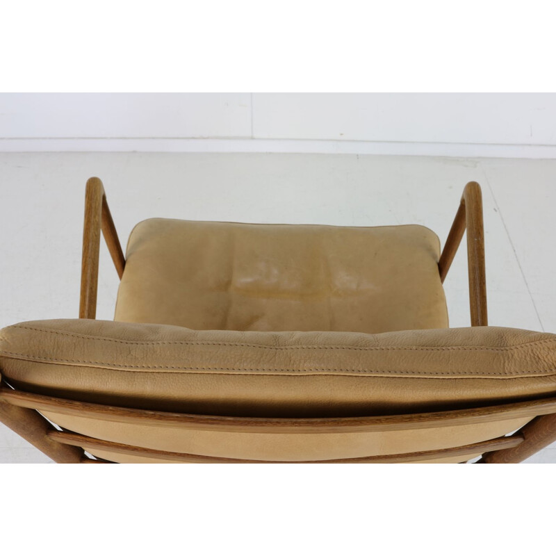 Vintage chair with beige leather cushion by Poul Jeppesen Denmark