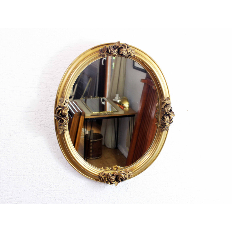 Vintage mirror gilded  with floral decoration in stucco