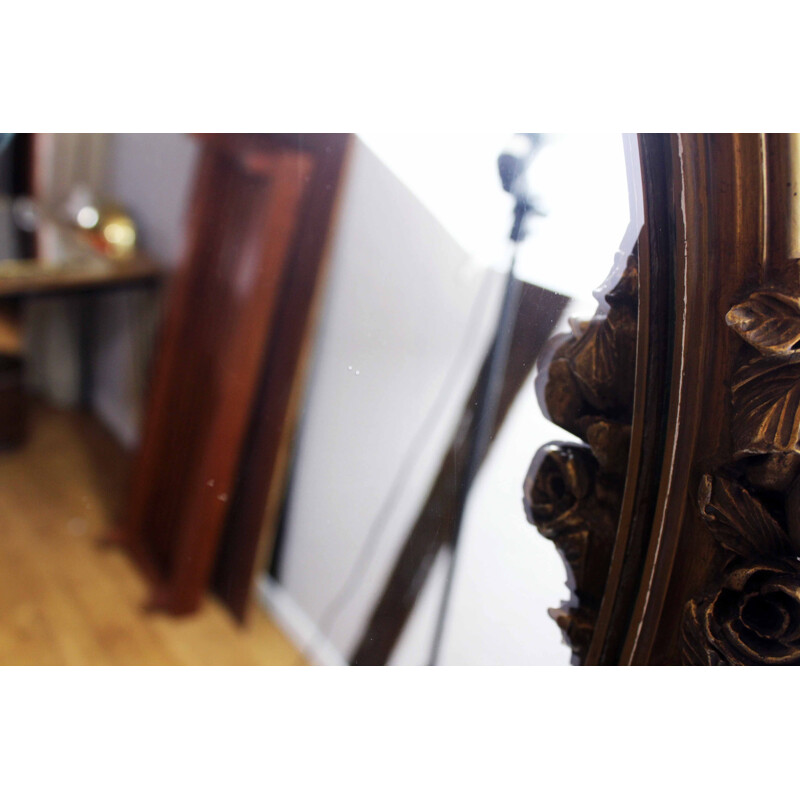 Vintage mirror gilded  with floral decoration in stucco