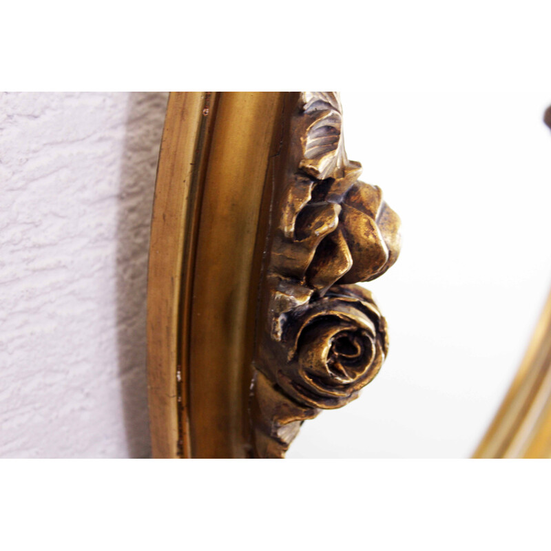 Vintage mirror gilded  with floral decoration in stucco