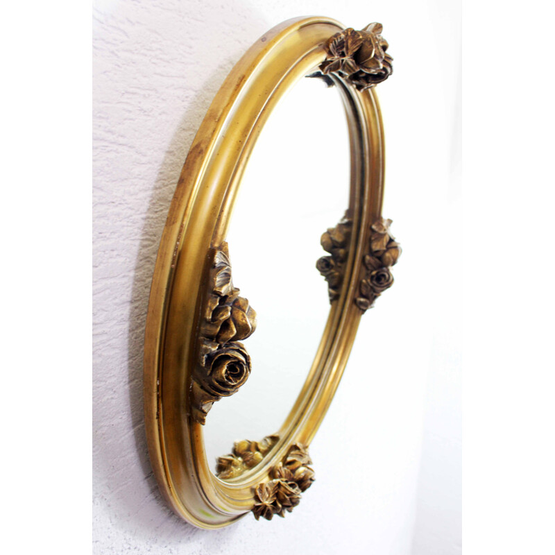 Vintage mirror gilded  with floral decoration in stucco