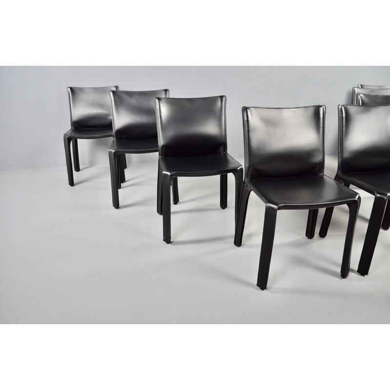 Set of 8 vintage black leather chairs by Mario Bellini 1977s