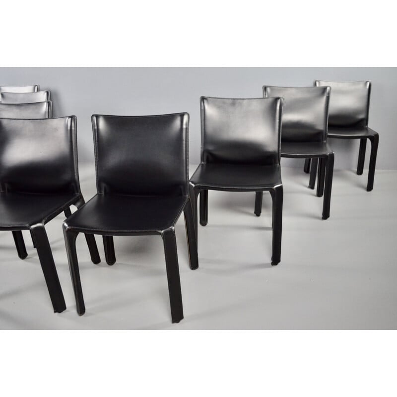 Set of 8 vintage black leather chairs by Mario Bellini 1977s