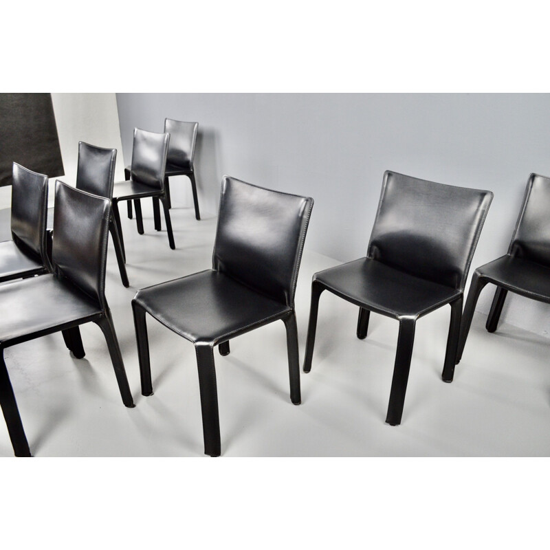 Set of 8 vintage black leather chairs by Mario Bellini 1977s