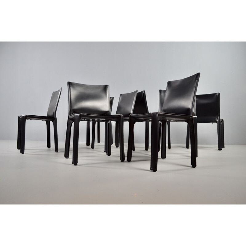 Set of 8 vintage black leather chairs by Mario Bellini 1977s