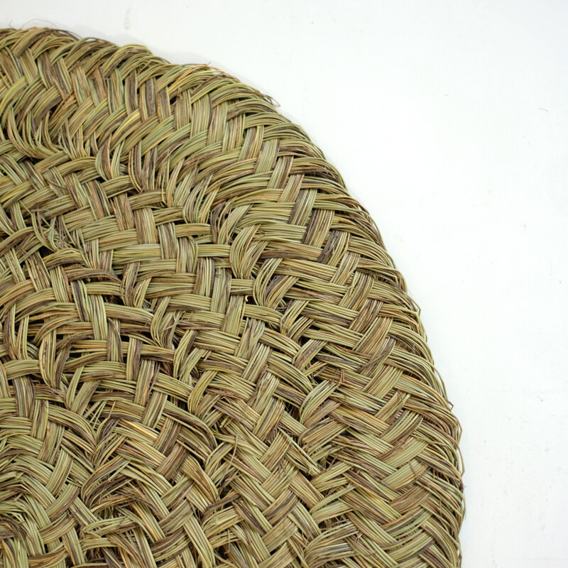 Round vintage carpet in natural fiber braided